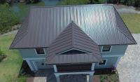 Home with a dark gray metal roof