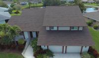 Home with a brown shingle roof
